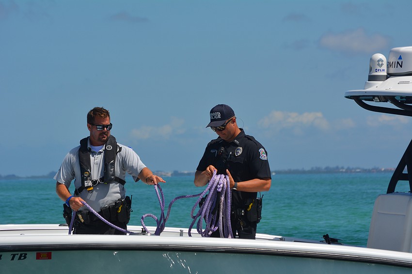 Mike Skinner, marine patrol, and Mike Daughtrey, patrol officer.