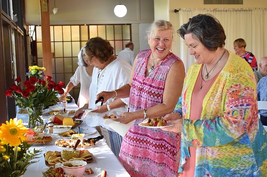 Lori Sikora and Heather George grab a few bites to eat.
