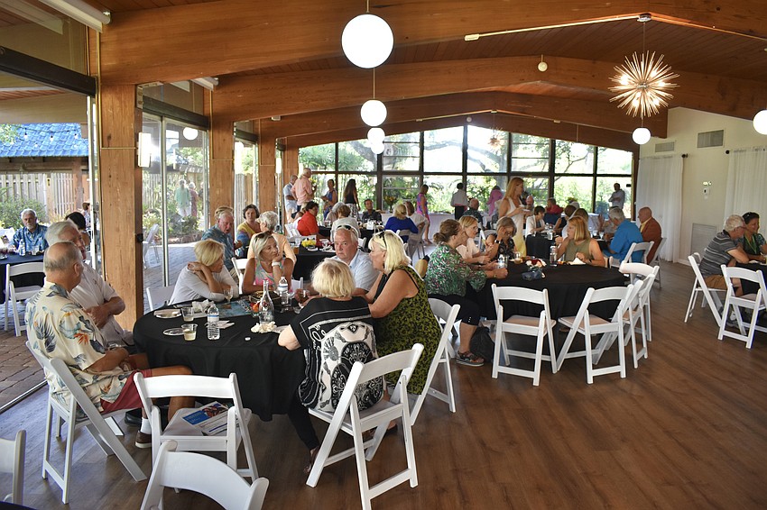 Guests gather at the tables at Sarasota Garden Club.