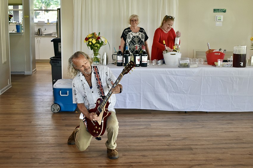 Lei Stanhoe of The JAM offers a free-roaming performance in front of Vice President CJ Danna and President Kelly Goodwin.