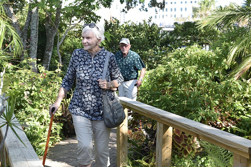Judith Linwood and Karl Fraedrich peruse the garden.