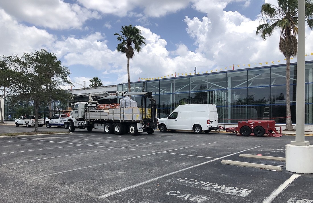 Crews work to convert a Tampa Rooms To Go that closed in late 2020 into a Bassett Furniture.