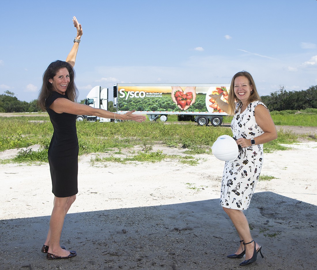 Laura DiBella, Florida's secretary of commerce, and Jane Grout, Sysco's president for the North Florida region, on the site of Sysco's new 504,000-square-foot distribution center in Plant City.