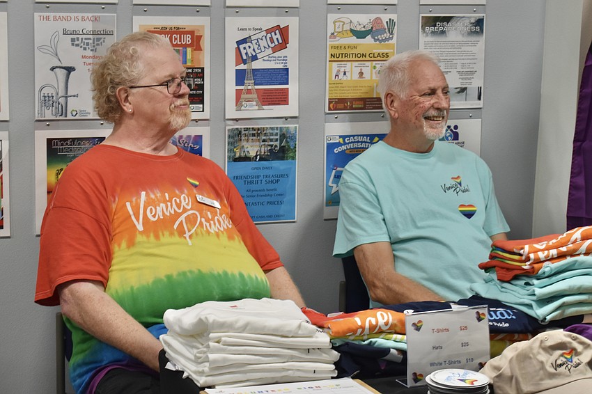 Jay Pennell and George Ward of Venice Pride listen to an announcement by Jason Champion, president of Project Pride.