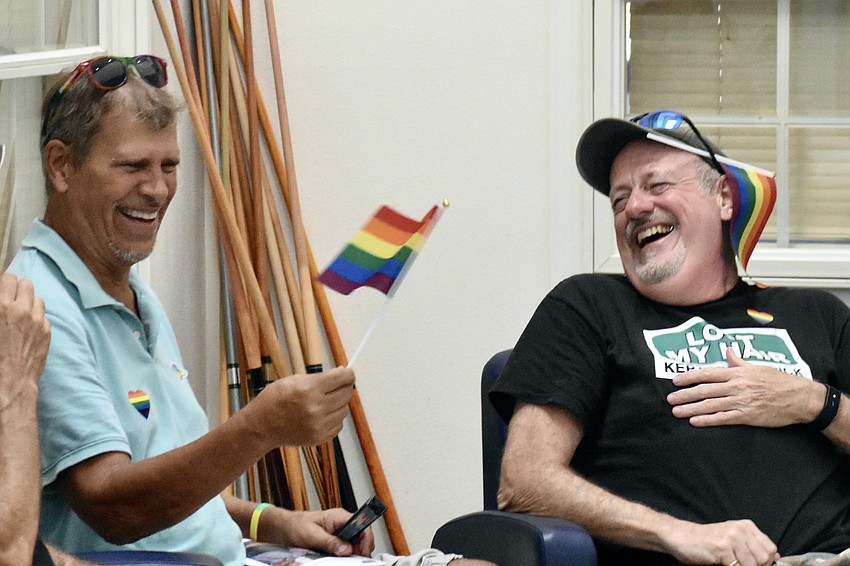 Tom Pokoewski and Simon Clark sit together at the event.