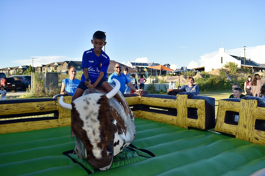 Bradenton resident Anthony Farias lasts nine seconds on the bull.