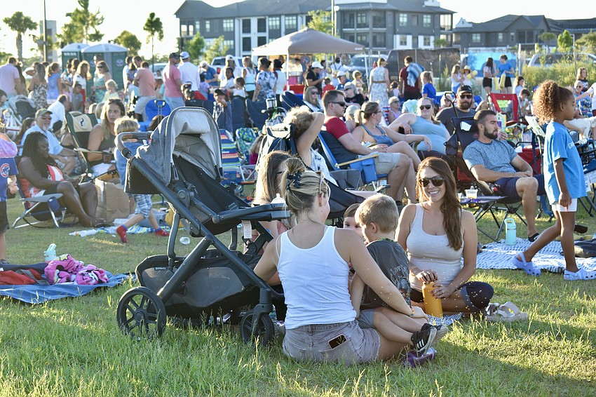 Families settle in for movie night at Waterside Place.