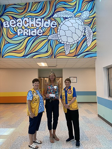 Past President Lion Bobbie Cheh, Beachside Elementary School Principal Barbara Bruner and Past President Lion Mary Yochum. Courtesy photo