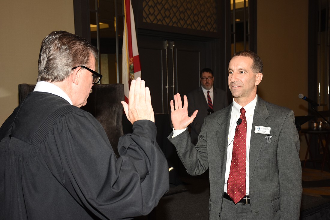 Blane McCarthy is sworn in as president of the Jacksonville Bar Association on June 15 by 4th Judicial Circuit Chief Judge Lance Day on June 15 at the group’s membership luncheon and awards ceremony at the Marriott Jacksonville Downtown