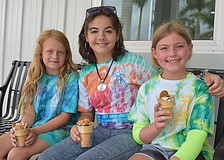 Hadley Chadwick, Mia Wolcott and Betsy Rohel make frozen treats for their four-legged friends.