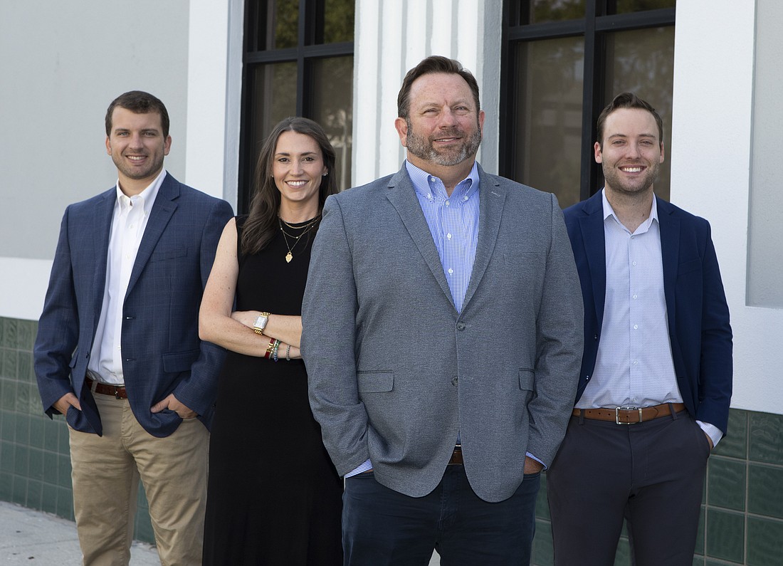 John Fahey (center) and his team — Grant Burt, Caroline Connelly and Jacob Rasnick — at Meridian Retail Group after the company was sold to SRS Real Estate Partners.