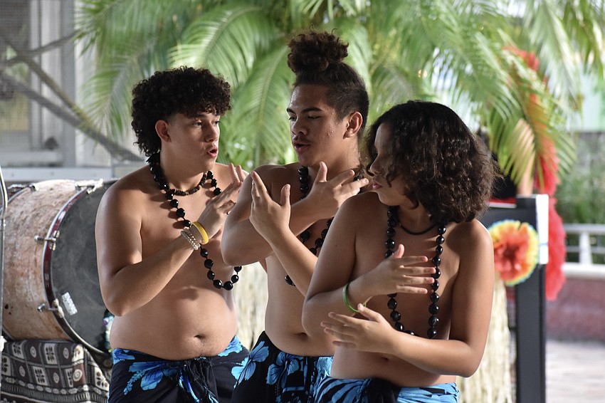 Taei Evans, Kamata Paongo, and Mafileo Evans perform with Echo of the South Pacific.