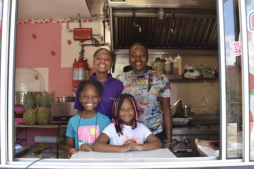8-year-old Deja Bright, 12-year-old Leilah Bright, 7-year-old Faith Bright and Briana Smith, owner of Mobile Desserts and Food
