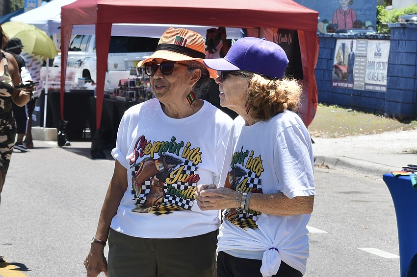 Visitors Jennifer Joseph and Nina Tortelli explore the market.