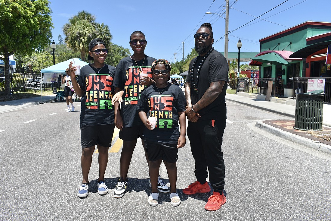 12-year-old Malcolm Gaudin, 13-year-old Mac Gaudin, 9-year-old Malik Gaudin, and Mac Gaudin celebrated Juneteenth at Newtown, including with their attire.