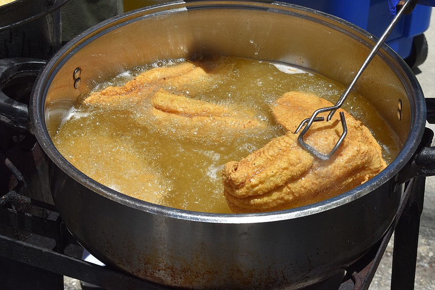 Fish are fried at Exquisite Eats.