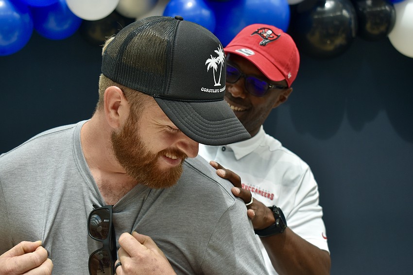 Jeremy Presley visits UTC from North Port to meet former Bucs safety Dexter Jackson.