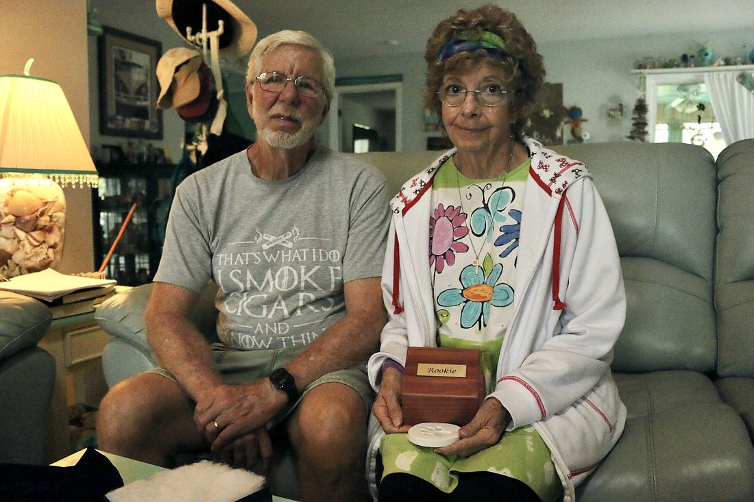 Randy and Carole Brasfield hold the cremated remains of their dog Rookie, a chihuahua mix that was killed by a pitbull mix on June 3. Photo by Sierra Williams