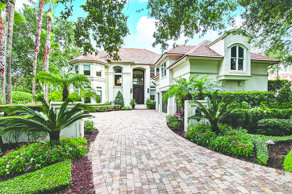This waterfront home is in Harbour Island in Marsh Landing Country Club. It features five bedrooms, seven full and one half-bathrooms, office, game room, theater, gym, pool and spa, porch and dock.