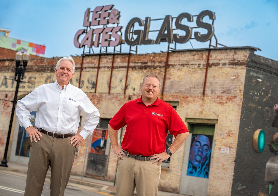 Tommy Lee, president and CEO of Lee & Cates Glass Inc., and Thomas D. Lee IV, vice president, outside the old Lee & Cates Glass store at 905 W. Forsyth St. in LaVilla Downtown.