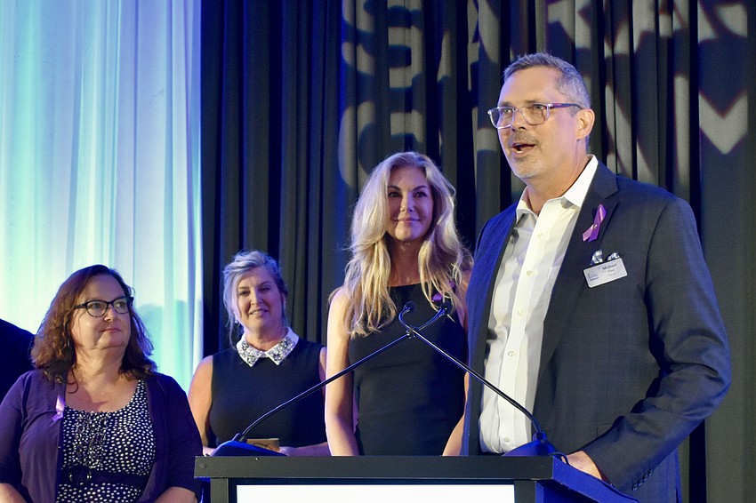 Town Square center director Jill Grinnell, Greater Sarasota Chamber of Commerce president and CEO Heather Kasten, and owners Sherri Finn and Michael Finn.
