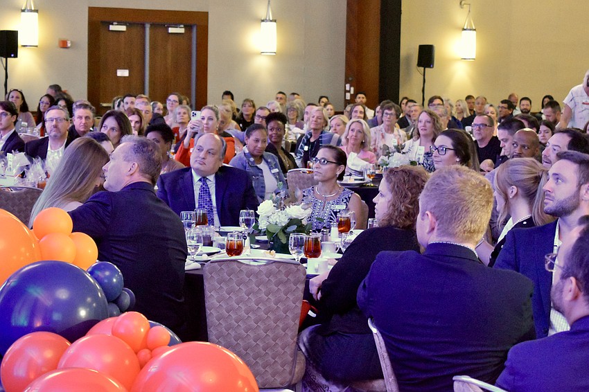 Attendees watch the ceremony.