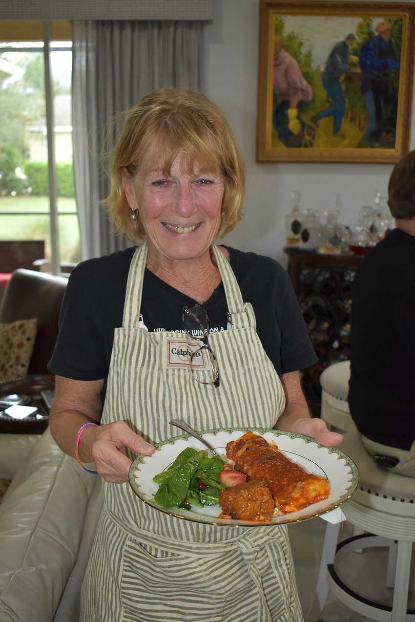 Lakewood Ranch's Kathleen Osterberg is about to try out the group's cooking talent.