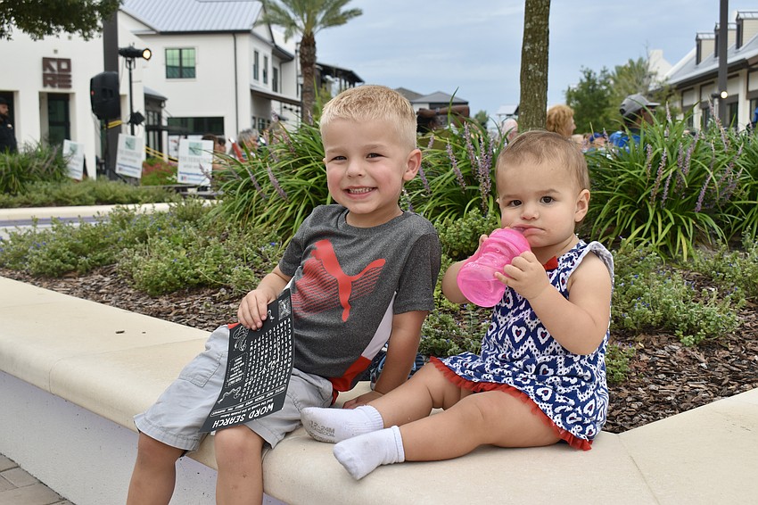 Lakewood Ranch residents Braden and Mila Chrachol keep busy during the Sights and Sounds music series at Waterside Place.