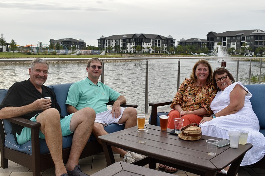 Randy Stull, Jack and Michelle Pilkington and Vanessa Stull meet at Waterside Place. The Stulls came from downtown Sarasota and the Pilkingons from Braden Pines.
