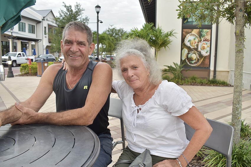 Lorraine Lakes residents John and Adriana Grech are regulars at the farmers market, but tonight, they're at Waterside Place for the music.