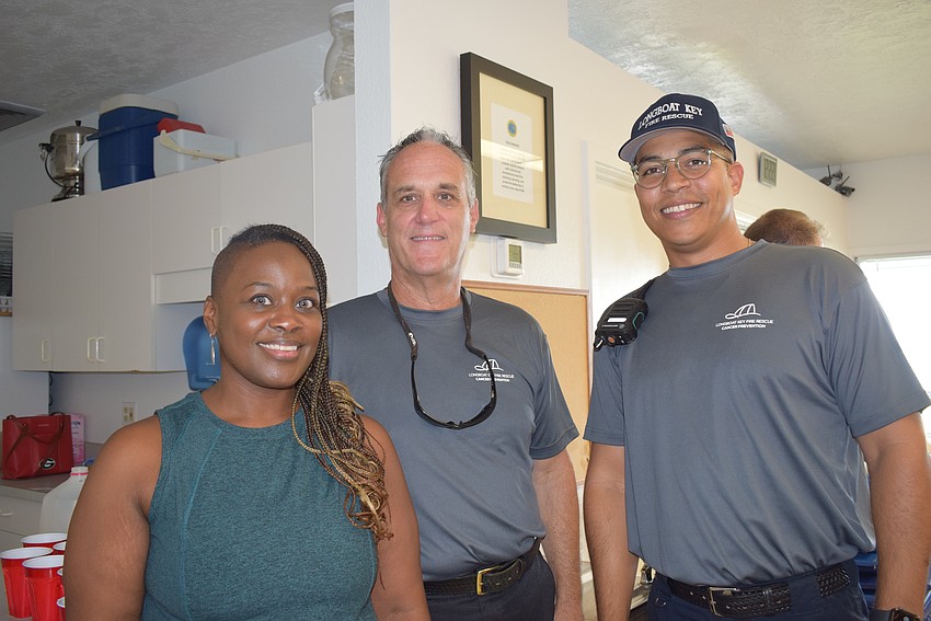 Ronica Jackson, Paul Dezzi and Tirso Guerrero engage in conversation during the luncheon.