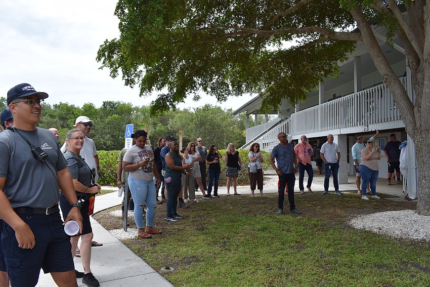 Town employees gather to watch their colleagues dunked in the dunk booth.