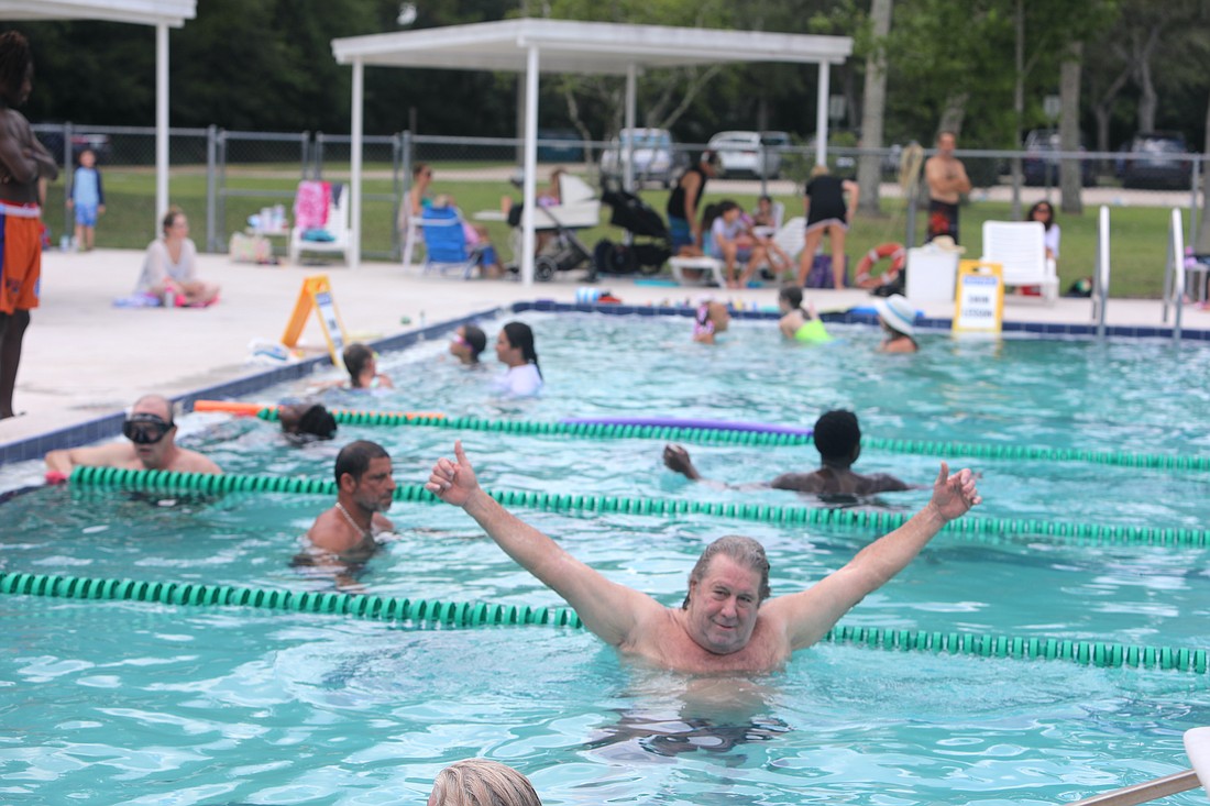 Guests and members cool off in the pool at the Belle Terre Swim & Racquet Club open house on June 25. Photo by Brent Woronoff