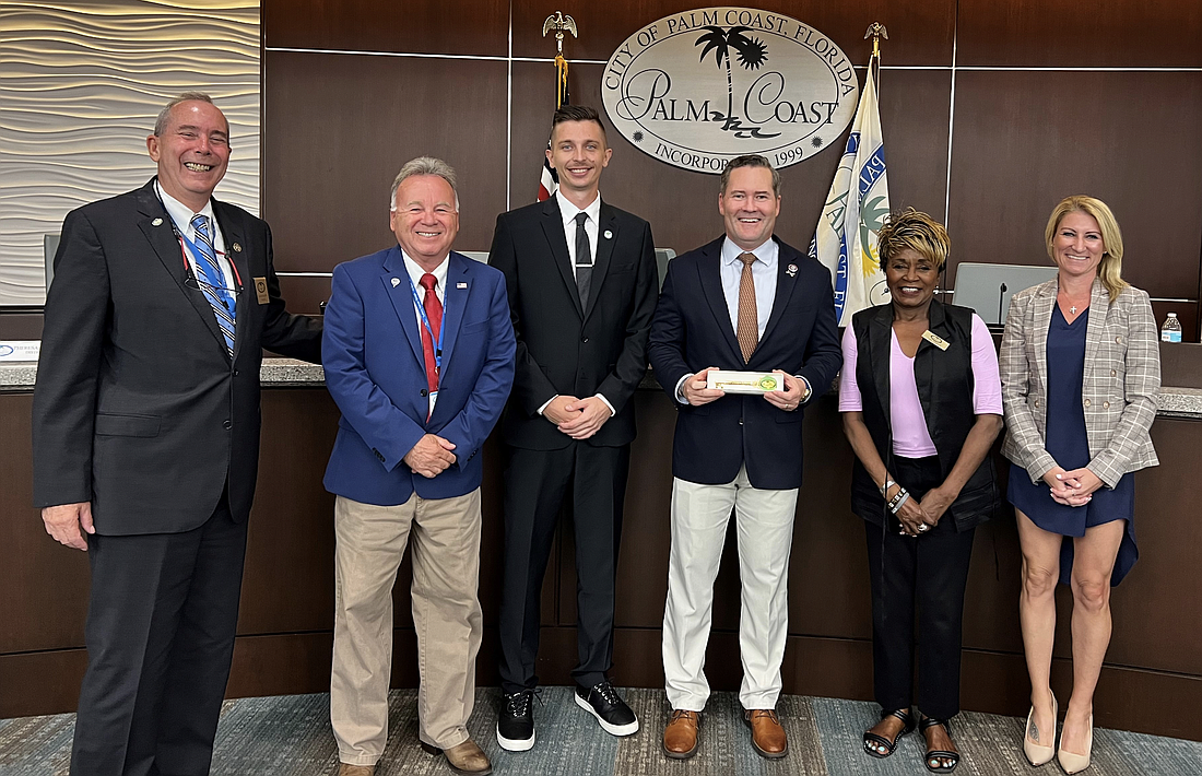 Palm Coast Mayor David Alfin, Vice Mayor Ed Danko, Council member Nick Klufas, United States Rep. Michael Waltz and Council members Cathy Heighter and Theresa Carli Pontieri. Photo courtesy of the city of Palm Coast