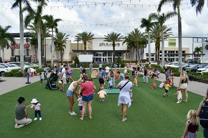 About 80 parents, grandparents and kids attend the UTC Kids Club at the Green.