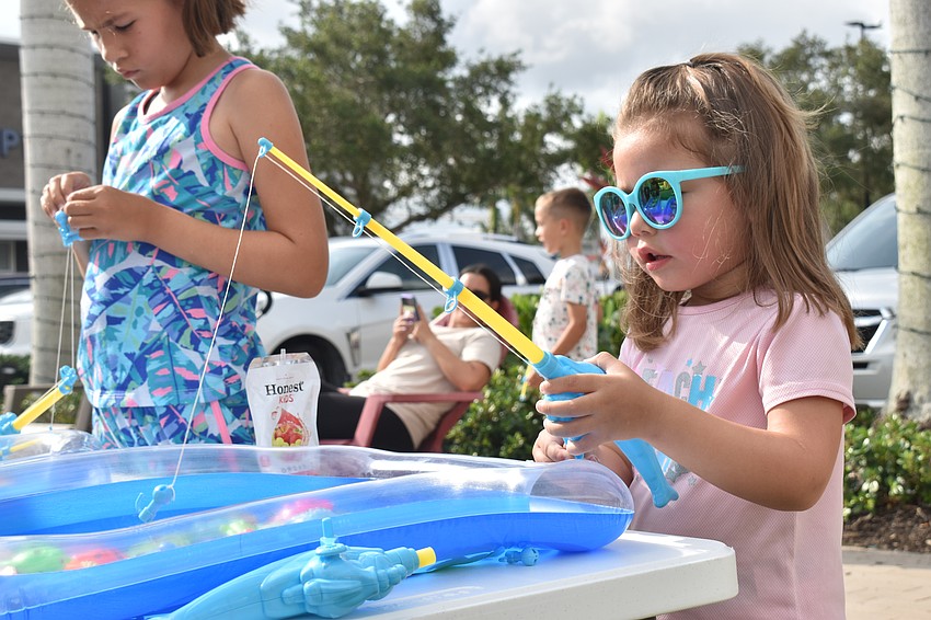 Three-year-old Mila Hernandez from Sarasota goes fishing with magnets.