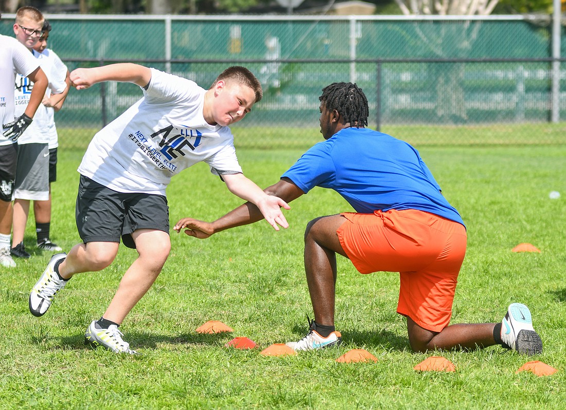 Blake Furrey, 13, doing the circle drill to practice how to stay low as a defensive lineman.