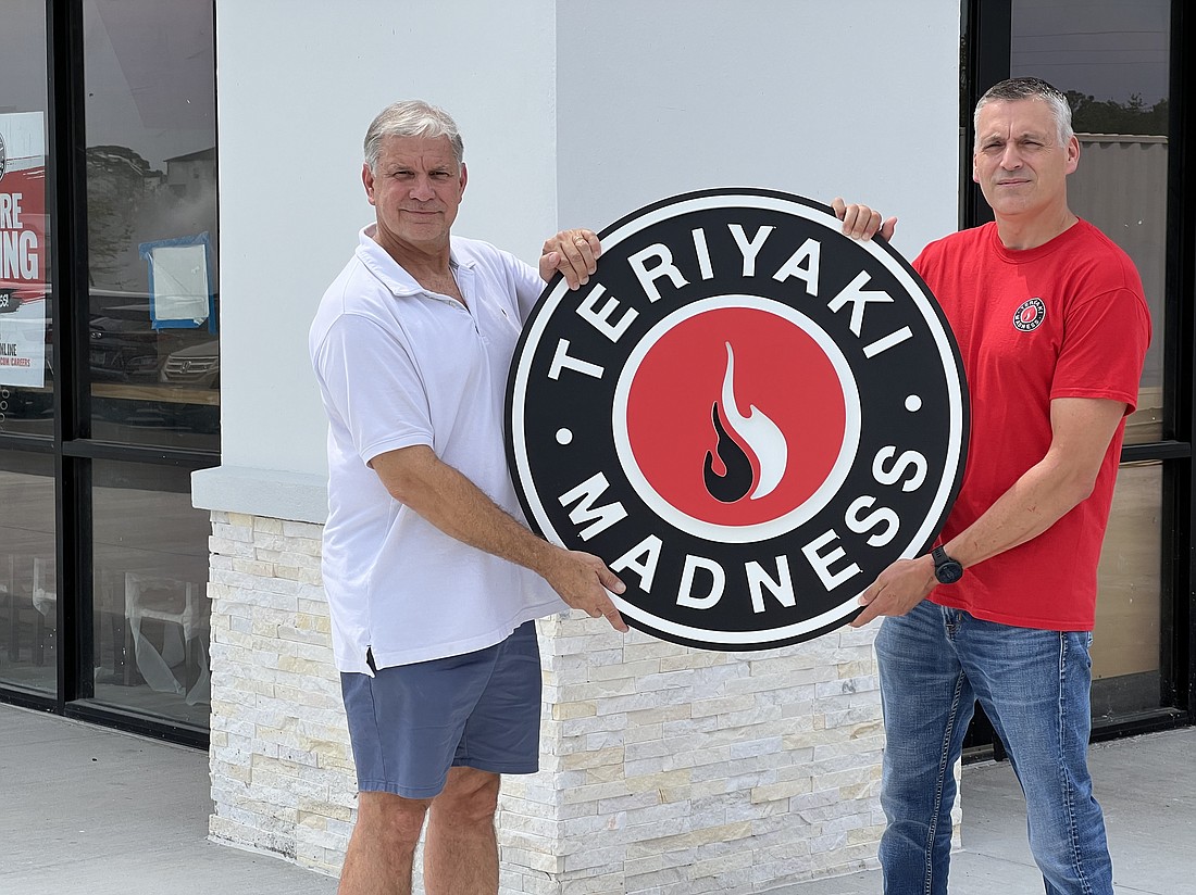 Business partners Dave Patrick and Robert Garnecki are waiting for state inspections to open Teriyaki Madness by late July.