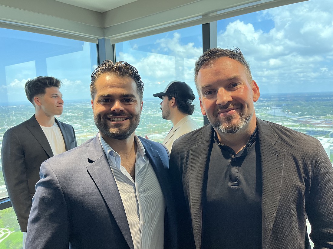 Andrew Koenig, right, spoke about his company's decision to go 'lean' at an event hosted by Young Entrepreneurs of America and the Tampa Club's Young Executives. Also pictured is Brock Laramee of YEA.