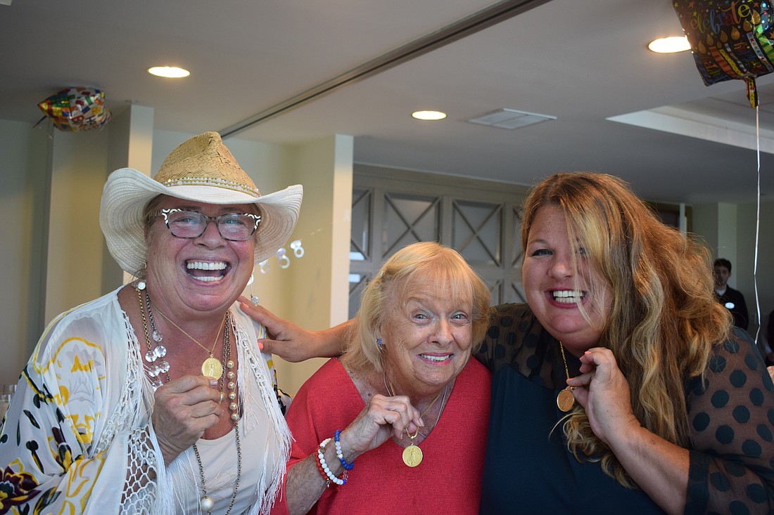 Sherry King, Shirley Martin and Melissa Martin showing off their Martin women medallions.