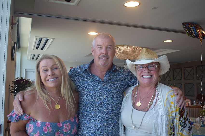 Siblings Ginger O'Connor, David Martin, and Sherry King celebrating their family.