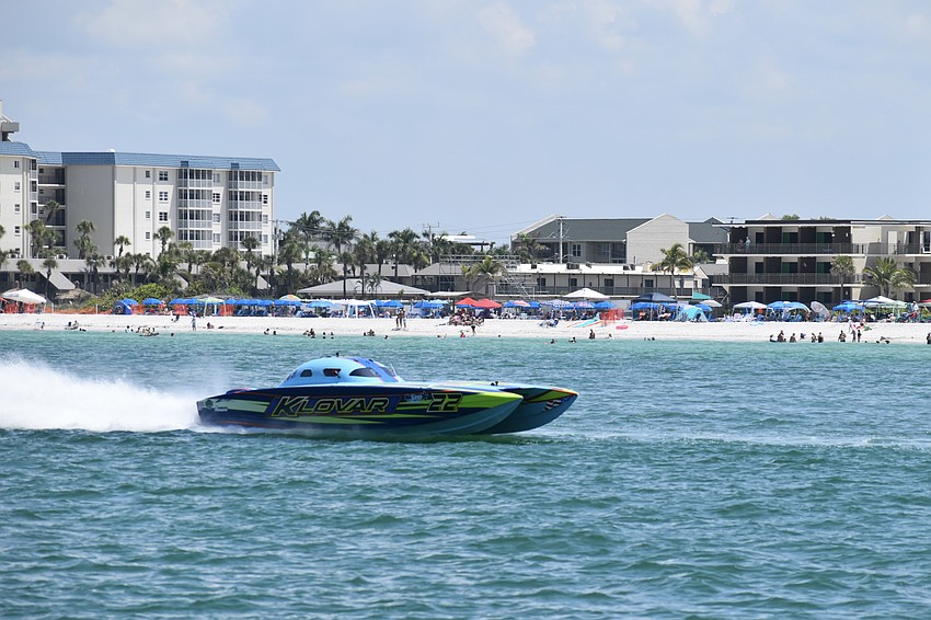 The KLOVAR Motorsports boat piloted by .Randy Keys of and Bill Allen of Iowa makes its way along the course.