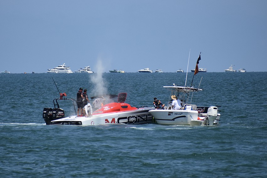 The Monster Energy / M CON.boat piloted by Myrick Coil of Missouri and Tyler Miller of Kansas catches on fire, although it will soon be extinguished by the crews present.