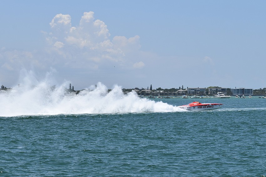 The .Huski Ice Spritz / SVEA Racing boat piloted by Brit Lilly of Maryland and Steve Curtis of Stuart, Florida kicks up a mist of sea spray.