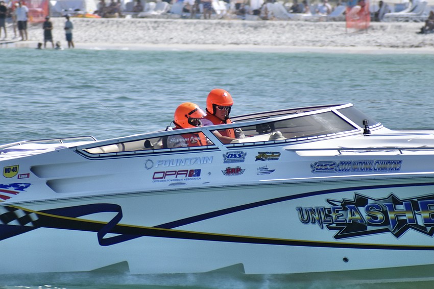 Shannon Penn and Michael Holt of Tennessee pass by Lido Beach in the Unleashed boat.