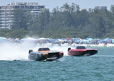 The Gladiator Canados boat piloted by Ervin Grant of Massachusetts and Michel Karsenti of Miami Beach, Florida races against the the Waves and Wheels / Doug Wright boat piloted by Logan Adan of Melbourne, Florida and Ricky Maldonado of Palmetto, Florida.