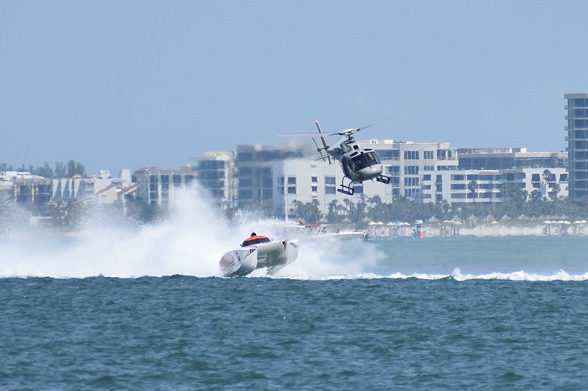 The Dirty Money Racing / Powerhouse Recycling boat piloted by Jason Ventura of Pompano Beach, Florida and Bill Pyburn of Jacksonville, Florida, leaps across the water.