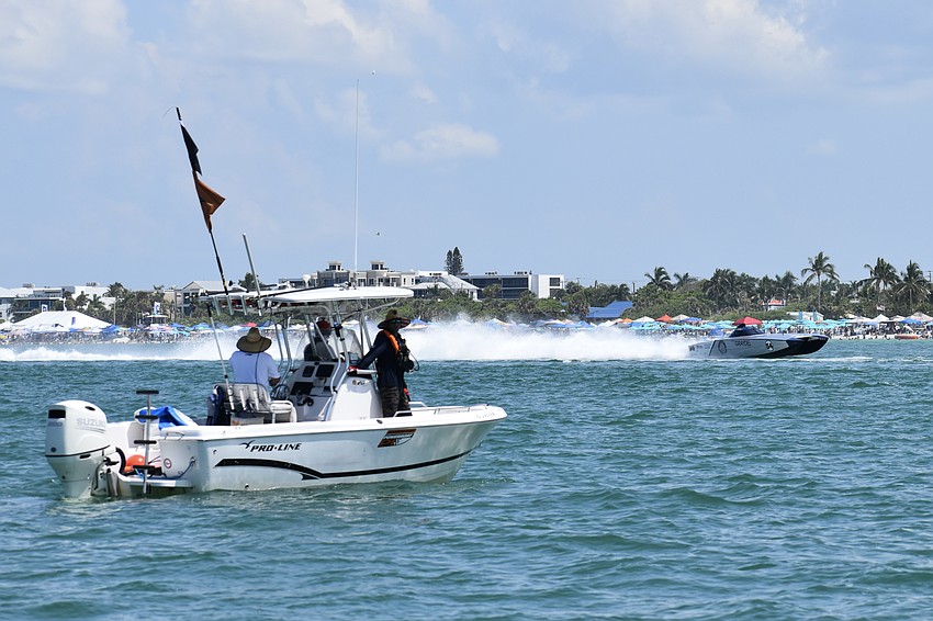 The Graydel / C.J. Grant Racing boat piloted by Chris Grant.of Canada and Billy Moore of North Carolina makes a pass by a support boat.