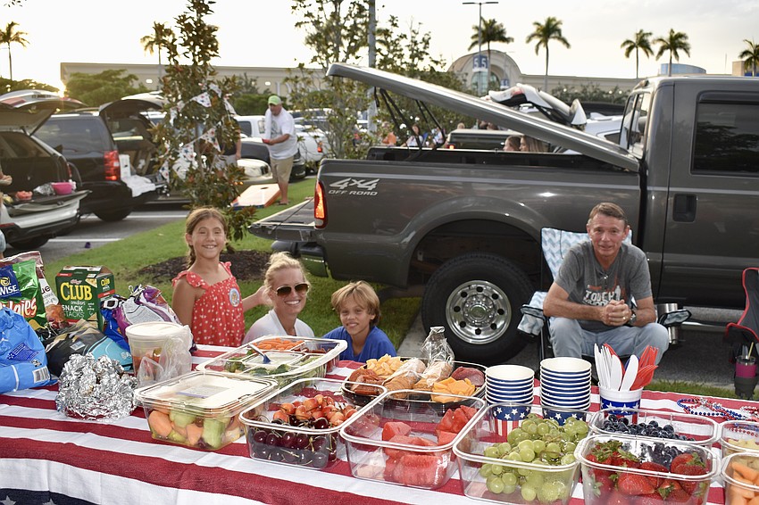 Sarasota residents Kelly, Katie and Josh Sweeting and David Green have fine tuned their tailgating skills over the years. This is not their first trip to the Mall at UTC to watch the fireworks on the lake.