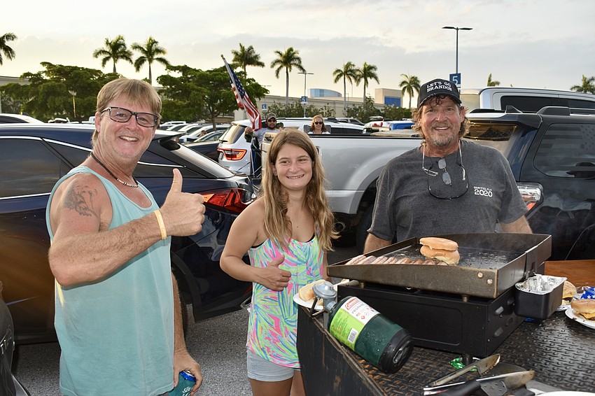 Myakka City resident Dave Henderson, Vero Beach resident Hailey Garrett and Palmetto resident David Cadmus are return tailgaters to the parking lot at the Mall at UTC.  Cadmus said they'll be back in the same spot next year.